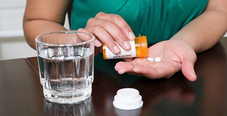 bel ağrısını hafifletmek için hap almak